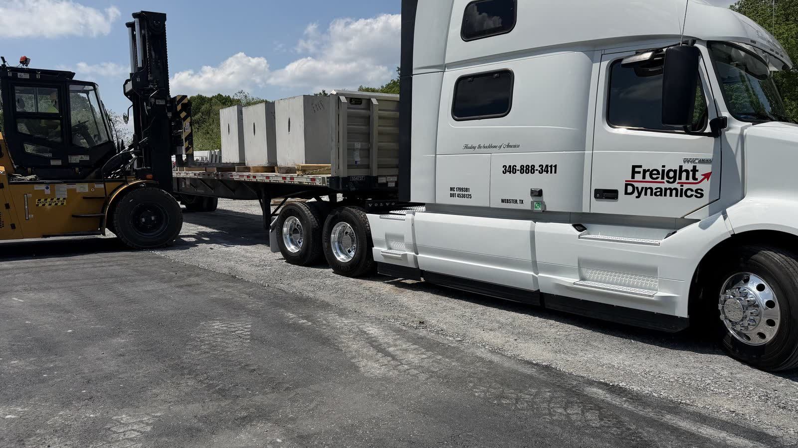 Forklift loading a Freight Dynamics trailer