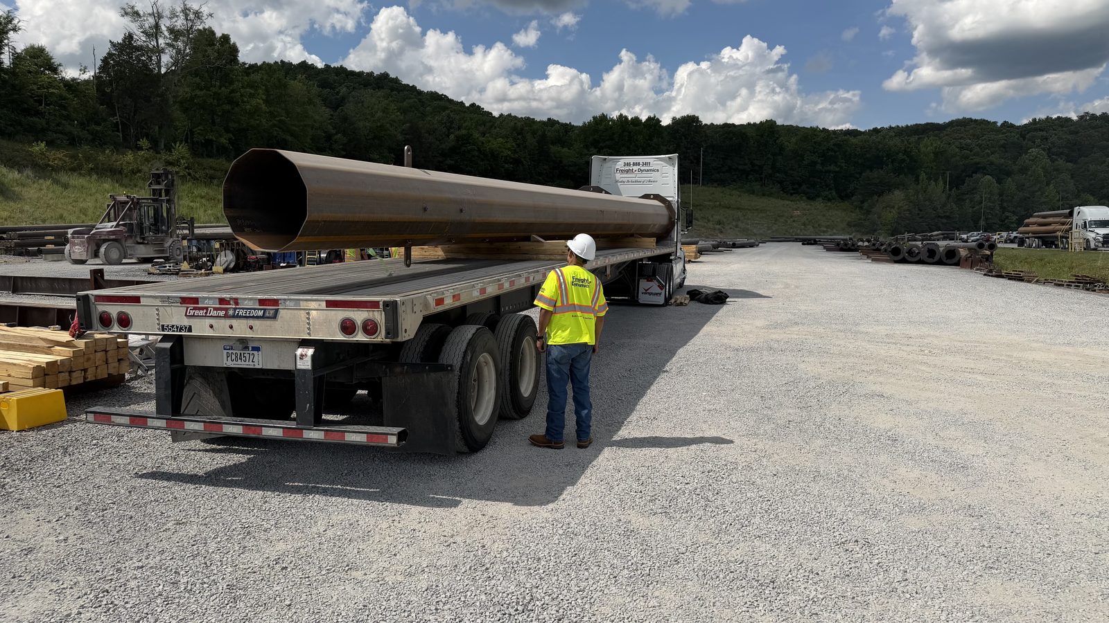 Steel pipe loaded on flatbed trailer