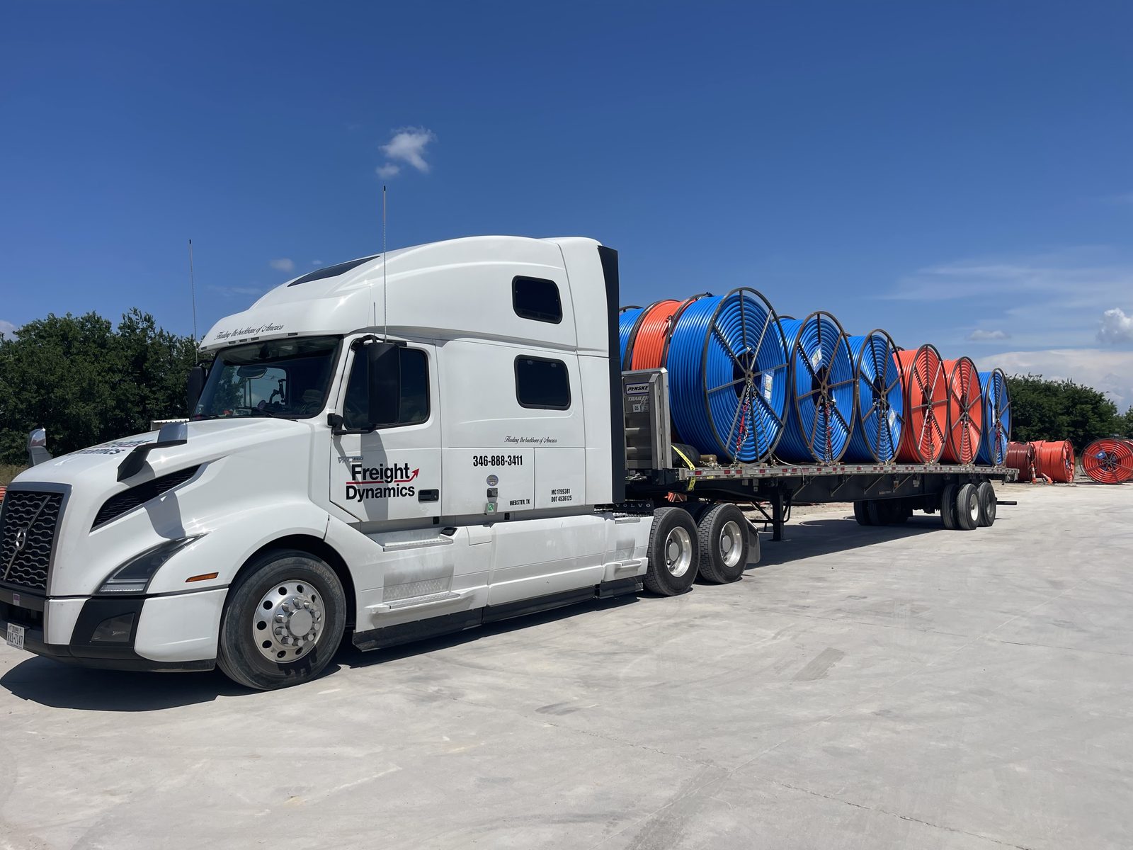 Conduit reels loaded on flatbed