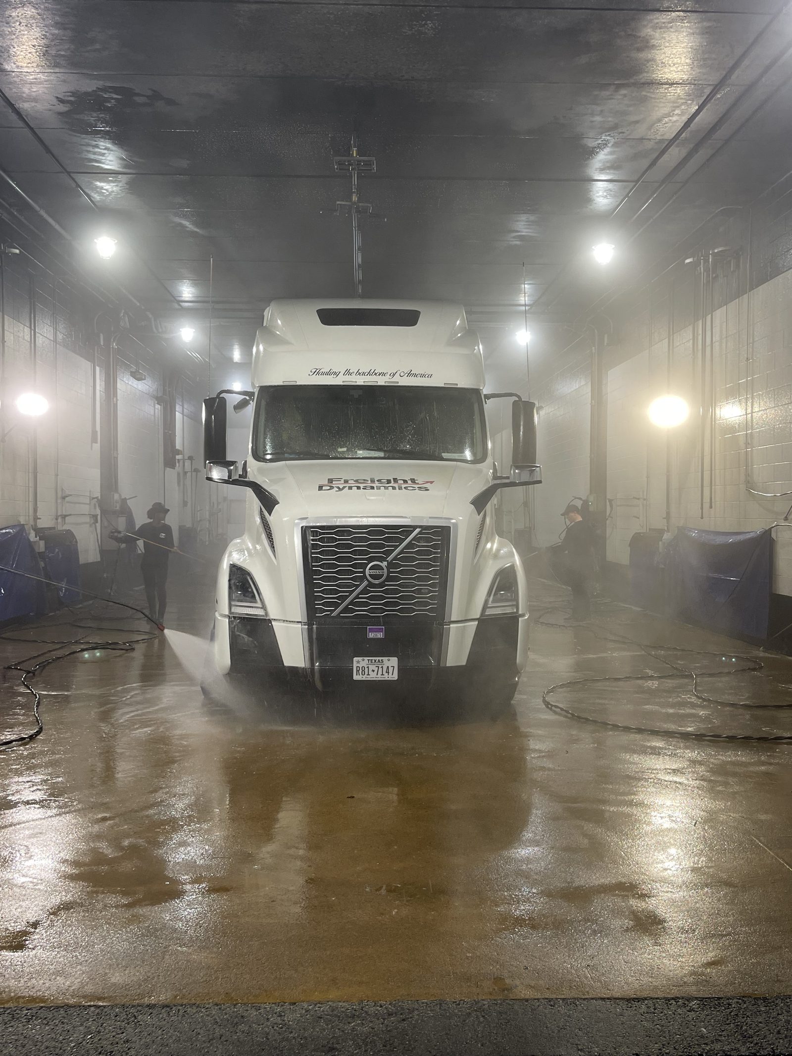 Tractor getting detailed at the truck wash
