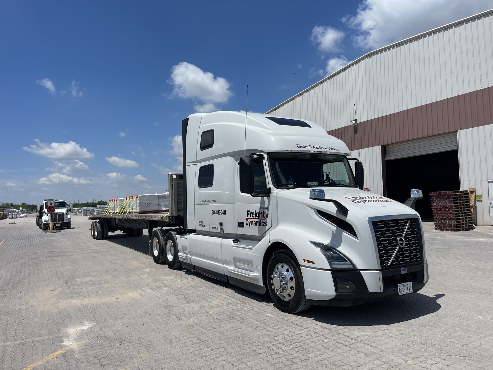 Loaded flatbed staged at warehouse